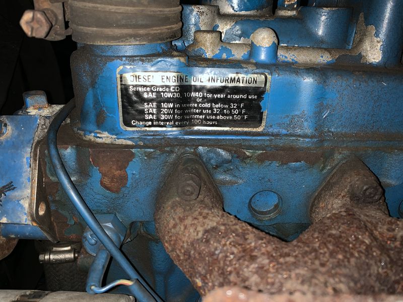 Diesel engine mechanical detail showing the heavy equipment power systems that support infrastructure development at AI Sustainable Foods farm